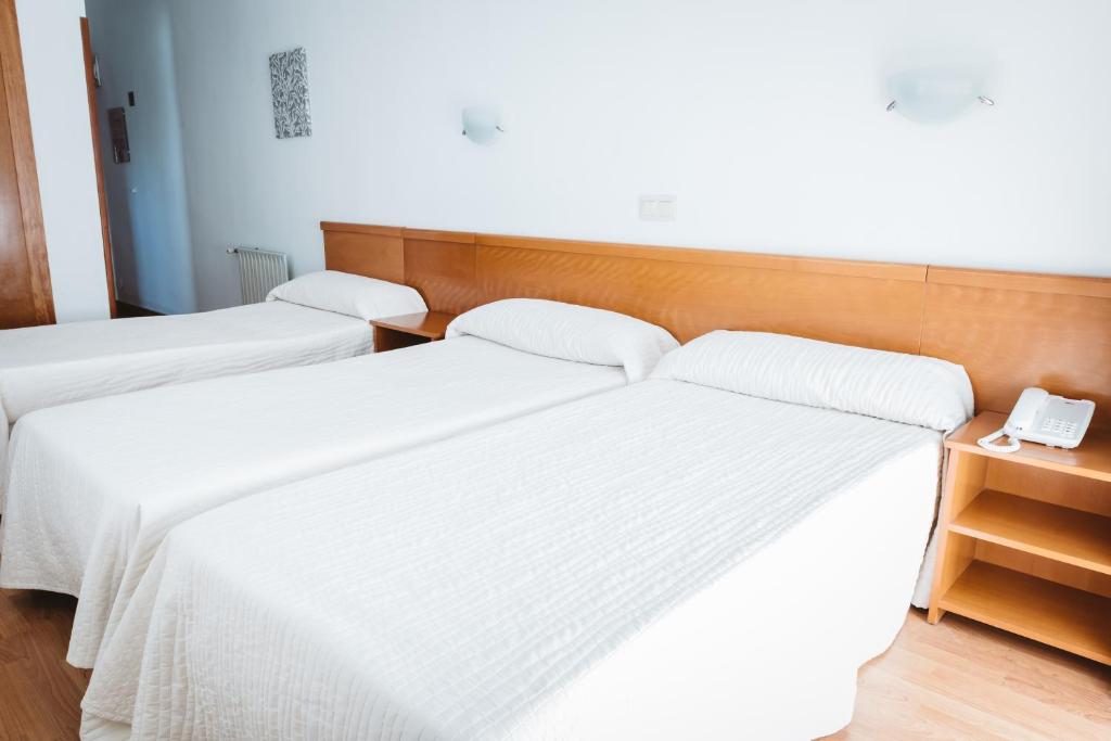 Postel nebo postele na pokoji v ubytování Hotel Teremar