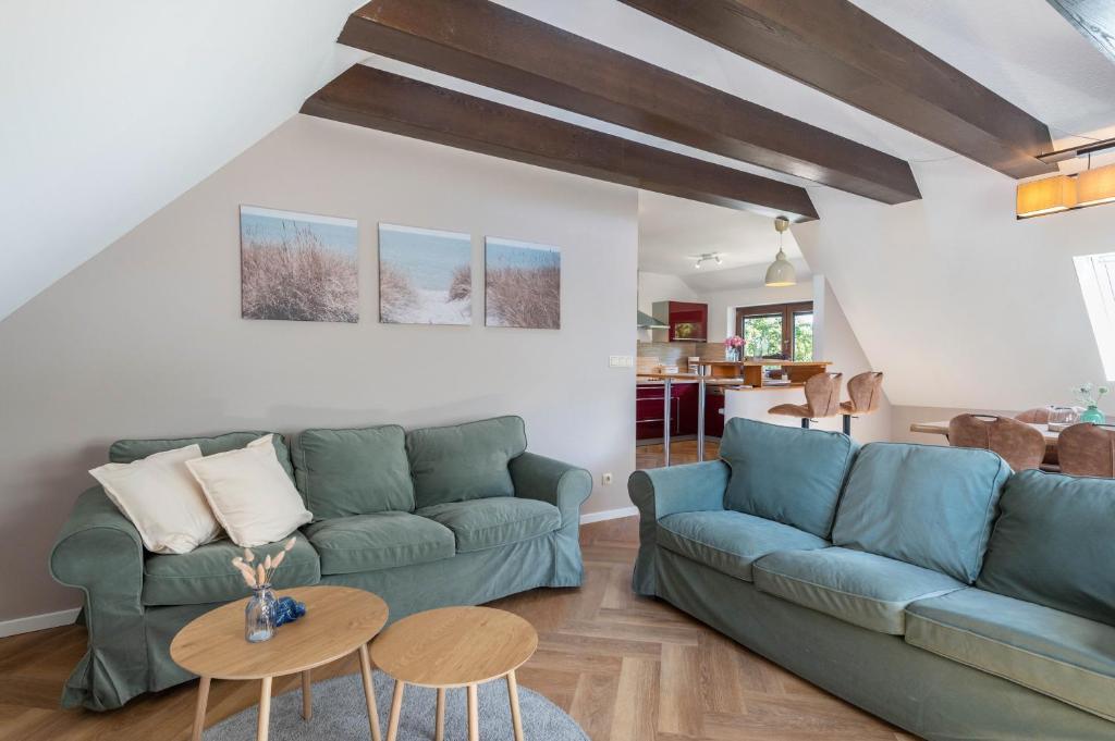 a living room with a couch and a table at Anker in Papendorf