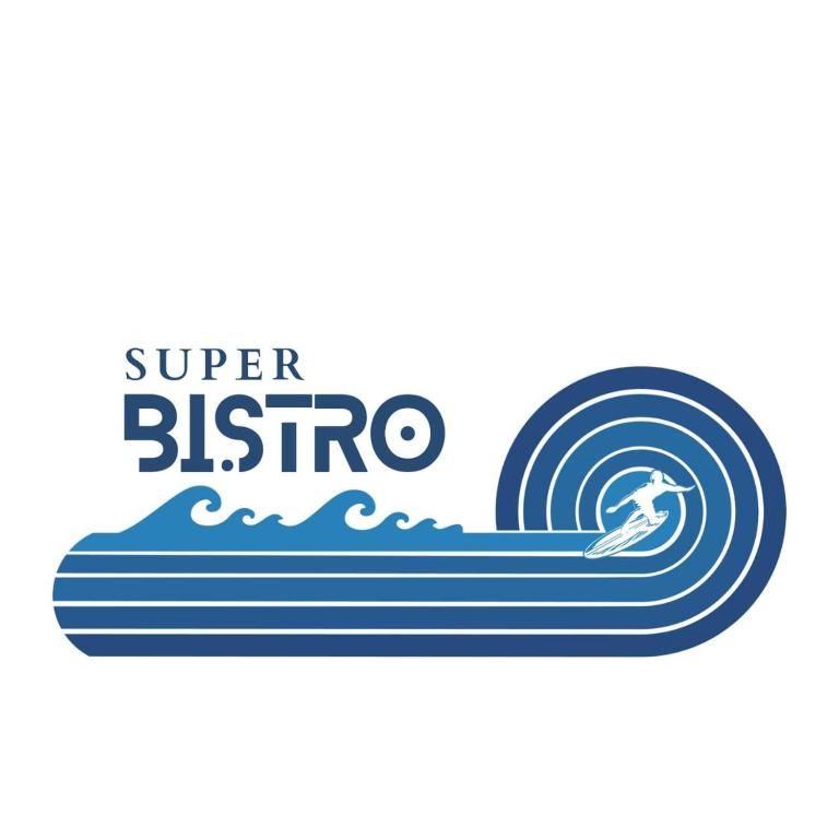 a surfer is riding a wave on a surfboard at Super Bistro in Pottuvil