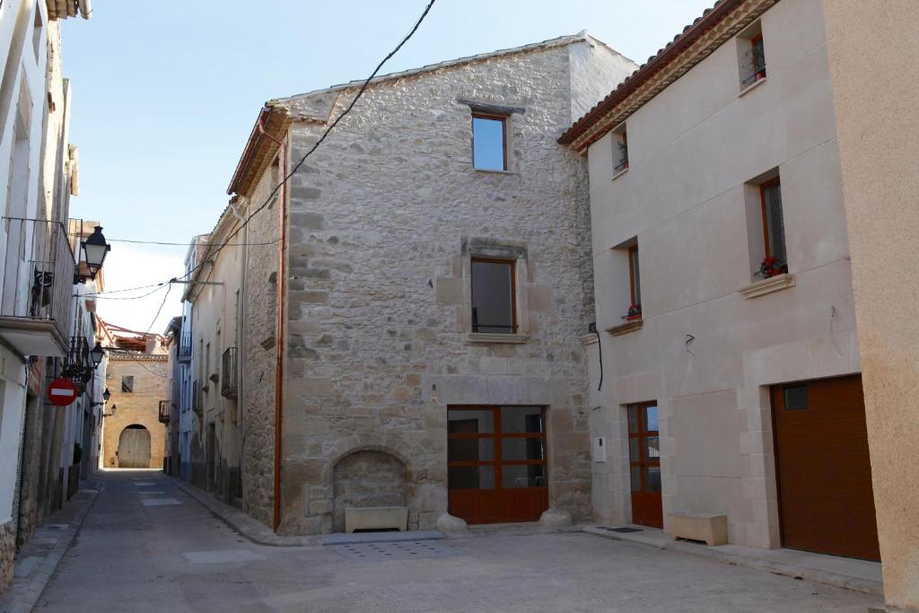 an alley in an old stone building at Cal Miqueló 1778 in Puig-Gros