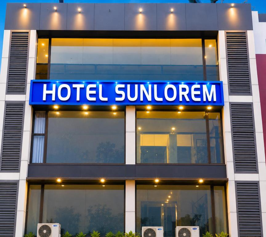 a hotel summergan sign on the front of a building at Hotel Sun Lorem, Ahmedabad in Ahmedabad