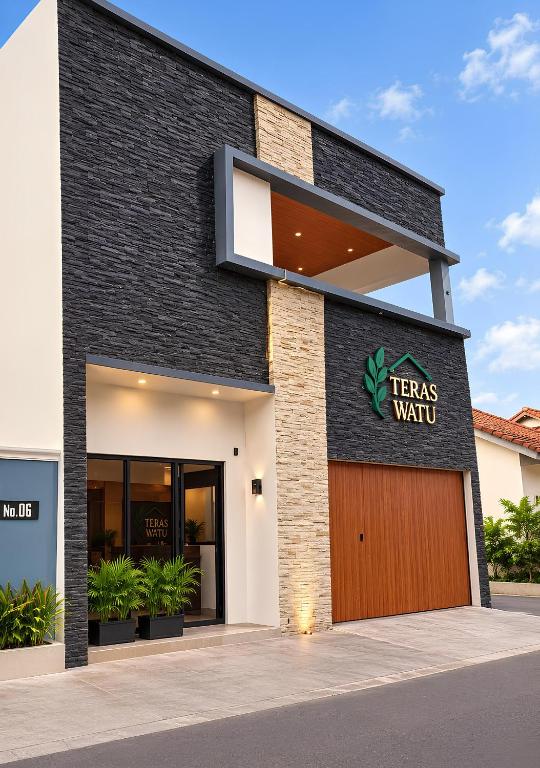 a building with a sign that reads herbs wait at Teras Watu Tegal in Tegal