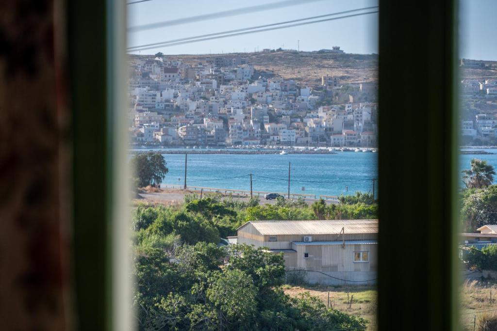 a view of the ocean from a window at Bellevue Apartments in Sitia