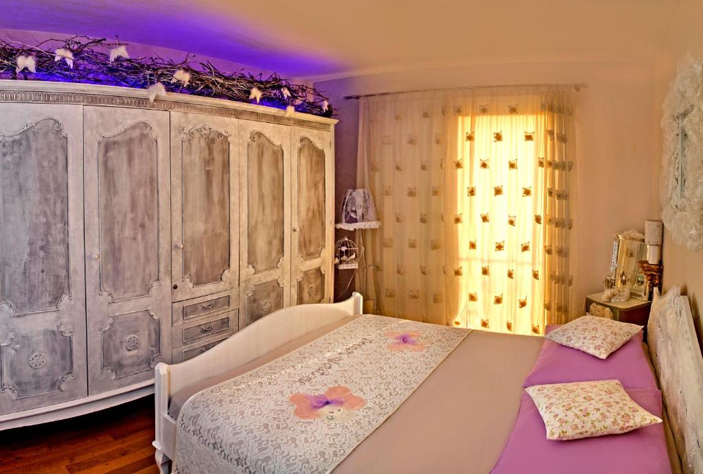 Postel nebo postele na pokoji v ubytování Villa Ria