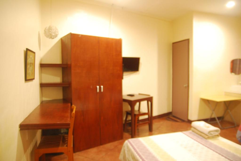 Voodi või voodid majutusasutuse Centro Mactan Suites toas