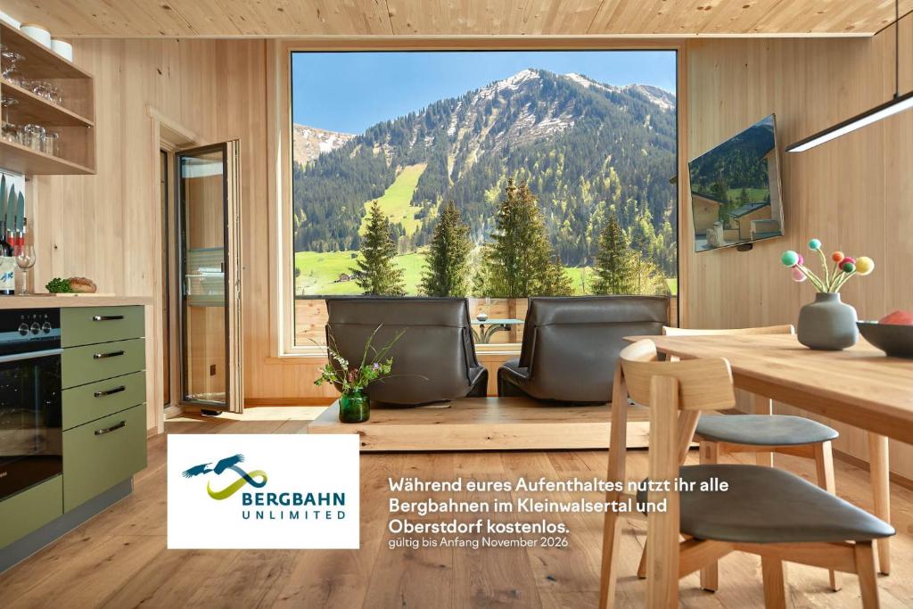 a kitchen with a view of a mountain at Spycher - Chalets für 2 in Riezlern