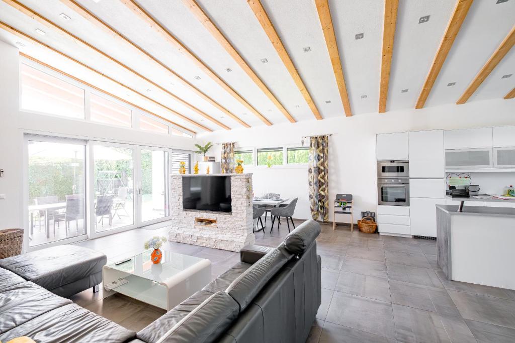 a living room with a couch and a fireplace at Freiraum Urlaubsapartment in Villach