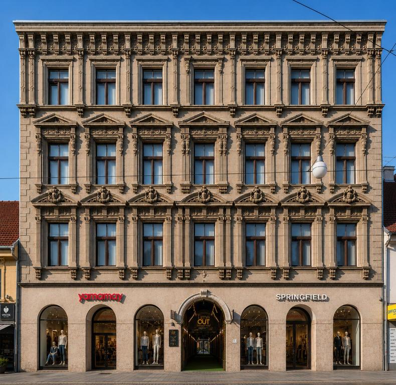 a large building with many windows on a street at Timeout Heritage Hotel Zagreb in Zagreb
