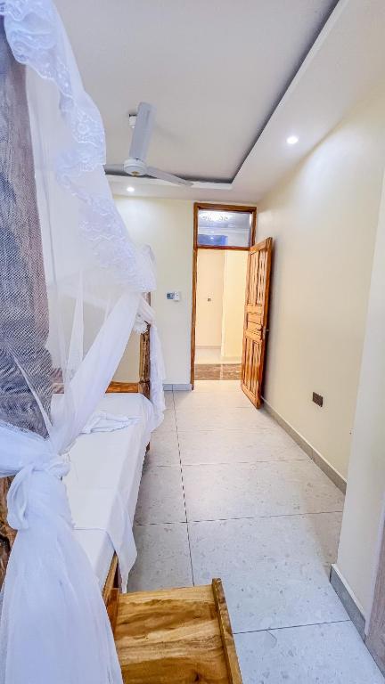 a bedroom with two beds in a room at J&T Holme Villa in Galu