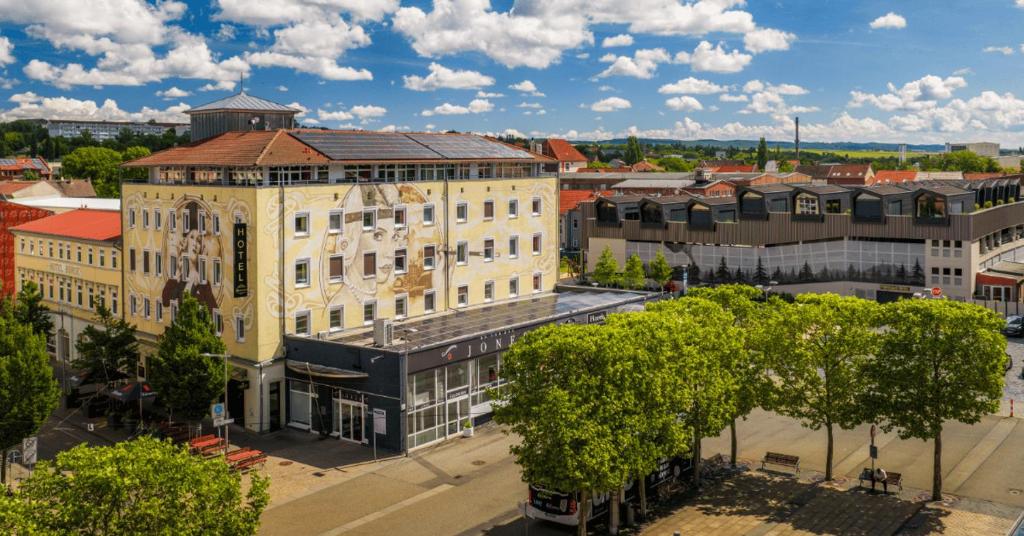 an overhead view of a large building in a city at Nordhäuser Fürstenhof & TinySky-Resort in Nordhausen