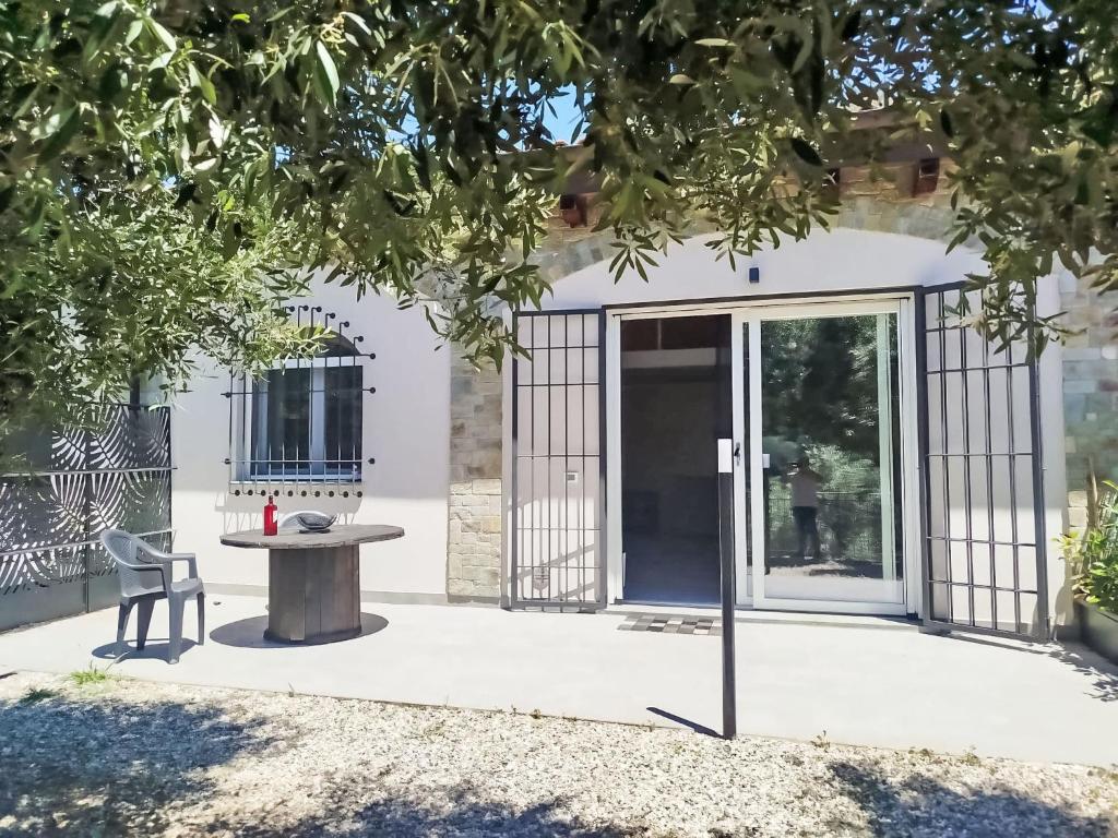 a patio with a table in front of a building at Apartment in Riga by Interhome in Cisano sul Neva