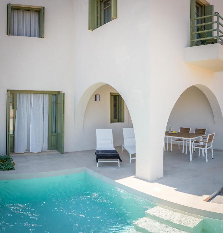 a villa with a swimming pool and a patio at Villa Selina 2 - Etheras Properties in Kythira