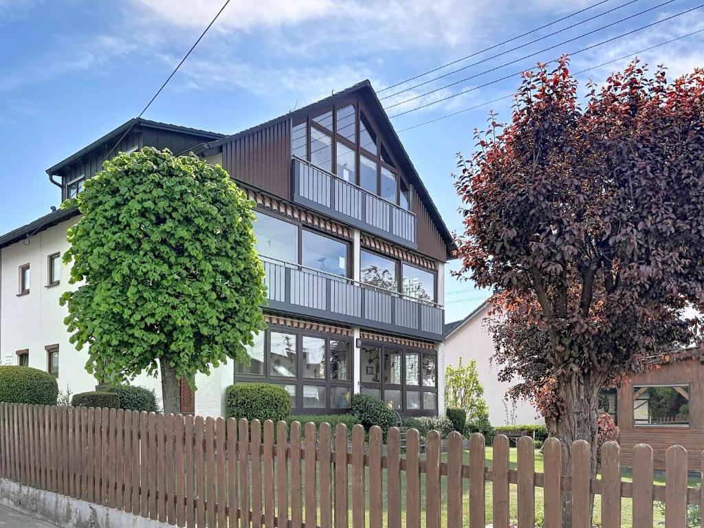 a large house with a fence in front of it at Studio Sirch-1 by Interhome in Diedorf