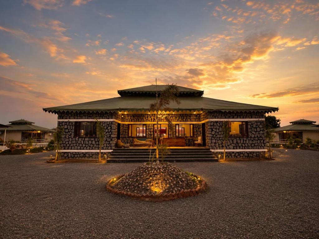 a building with lights in front of it at Jawai Garh Resort in Bīsalpur