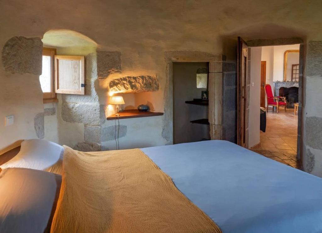 a bedroom with a large bed in a room at Château de Mézerville in Mézerville