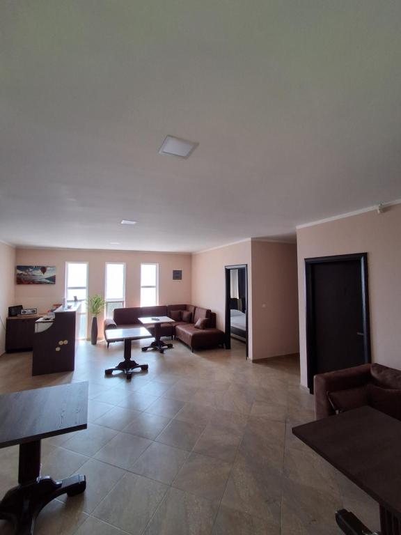 a living room with a couch and a table at Berane Rooms in Berane