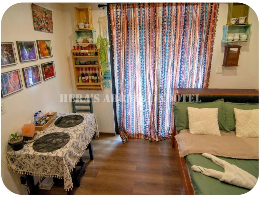 a living room with a couch and a table at Megatower 4 Diorite Unit in Baguio