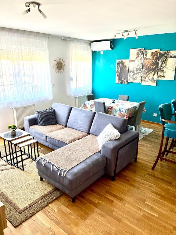 a living room with a couch and a table at Sophia in Vranje