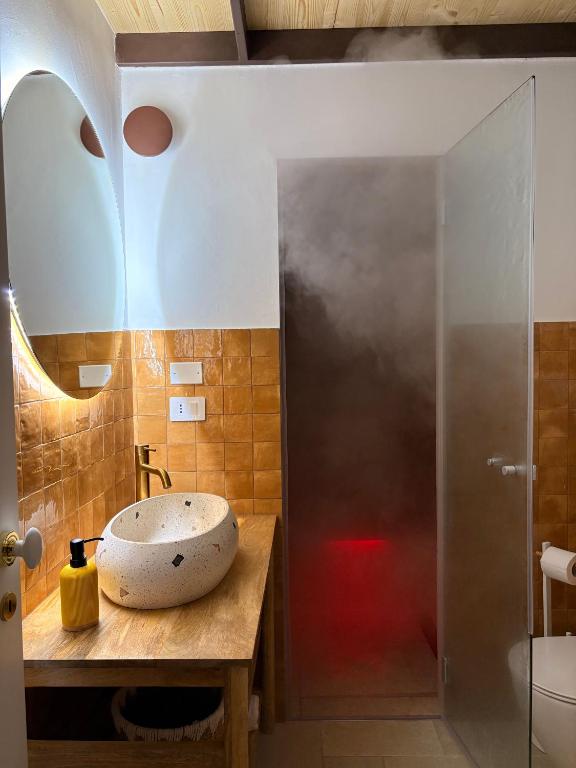 a bathroom with a sink and a shower at Stella Apartment in Nardò