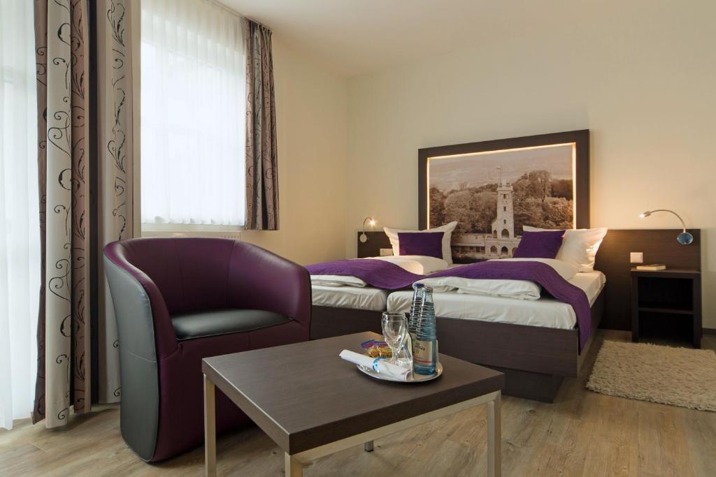 Postel nebo postele na pokoji v ubytování Hotel & Restaurant Schaumburger Ritter, Rinteln