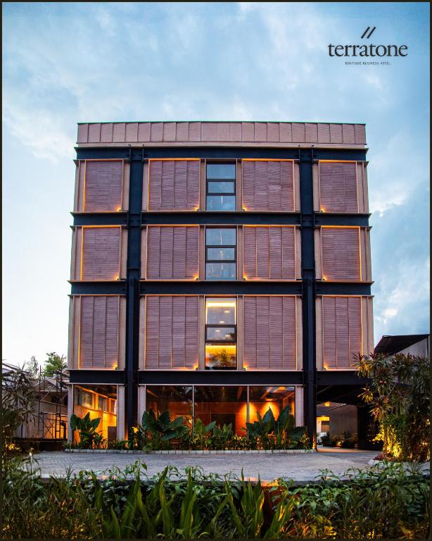 a tall building with large windows at Terratone Boutique Business Hotel in Kollam