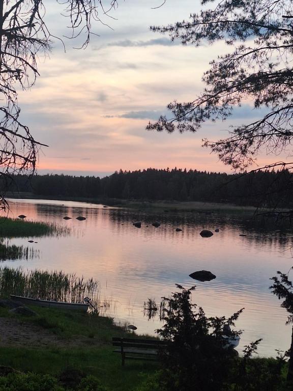 a view of a lake at sunset at Aijas Semesterstugor in Vaasa