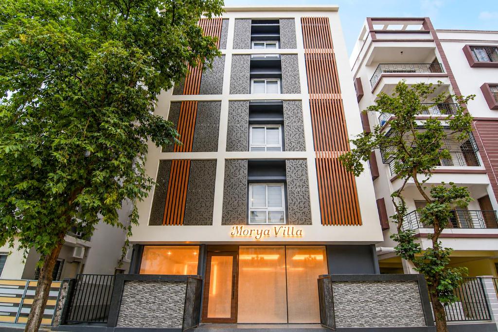 a building with a sign that reads happy valley at Morya Villa - A Boutique Hotel in kolkata
