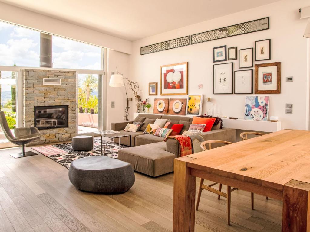 a living room with a couch and a table at Villa Mulberry Garden by Interhome in San Marcello