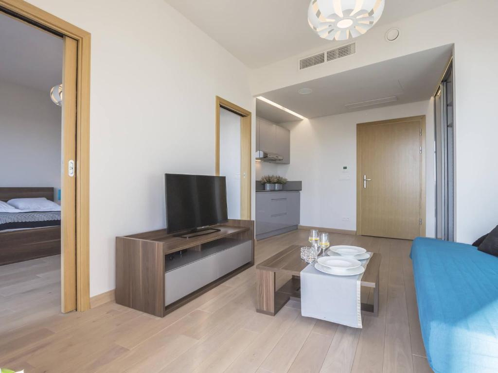 TV a/nebo společenská místnost v ubytování VacationClub - Diune Apartment 502B