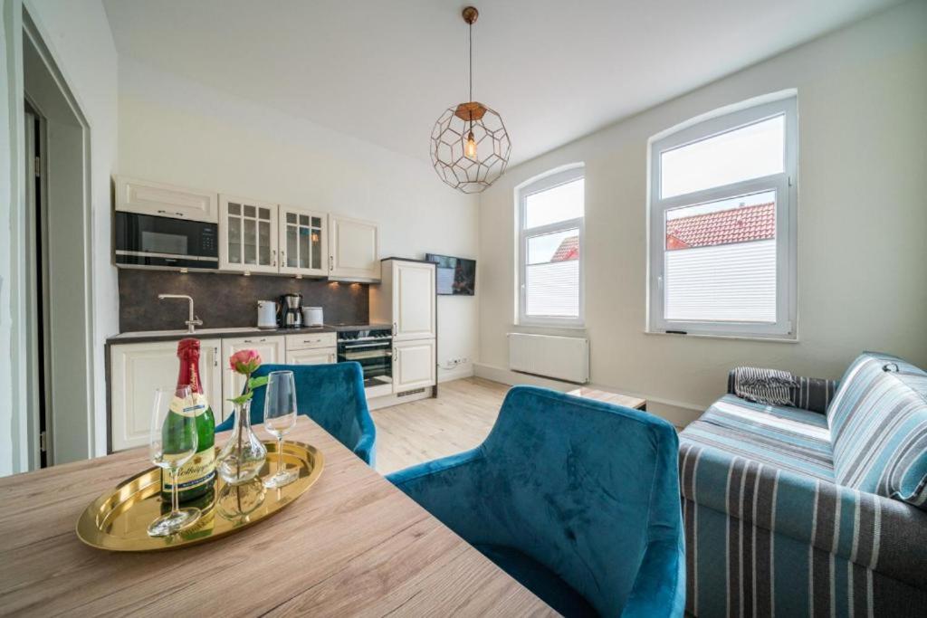 a kitchen and living room with a table and chairs at Villa Sofia in Borkum