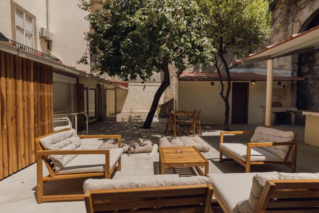 a patio with a bunch of chairs and tables at Dear Porto By Hosty in Porto