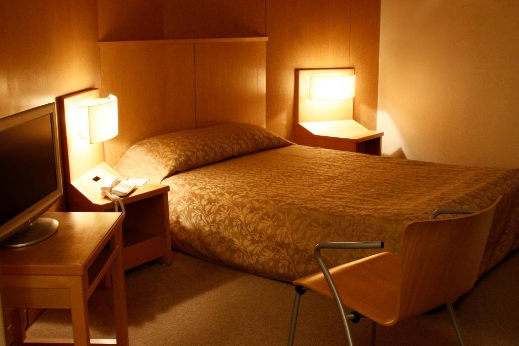 TV o dispositivi per l'intrattenimento presso Hotel Grand Vert Gizan