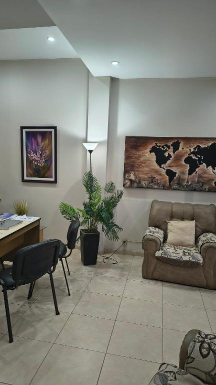 a living room with a couch and a table at Complejo turistico ALOJARTUR in San Rafael