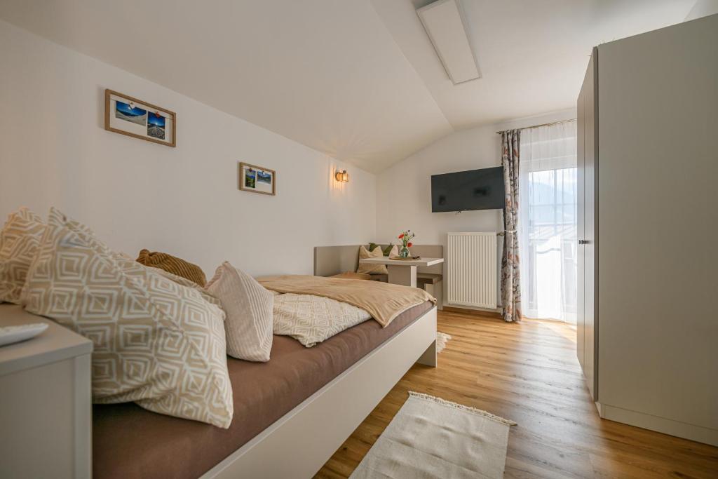 a bedroom with a large bed in a room at Alpenplatzl XS in Bad Hofgastein