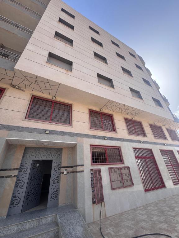 a tall building with a door in front of it at Apartment Selouane in Selouane