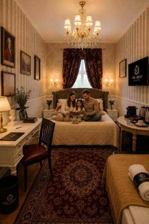 a family sitting on a bed in a bedroom at Urban Budget Hotel- Unique Boutique Hotel on Best Location in Vienna