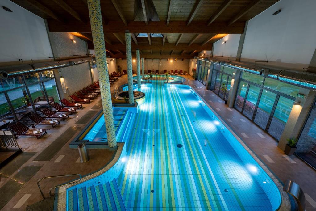 an overhead view of a large swimming pool at Hotel Bystrá in Brezno