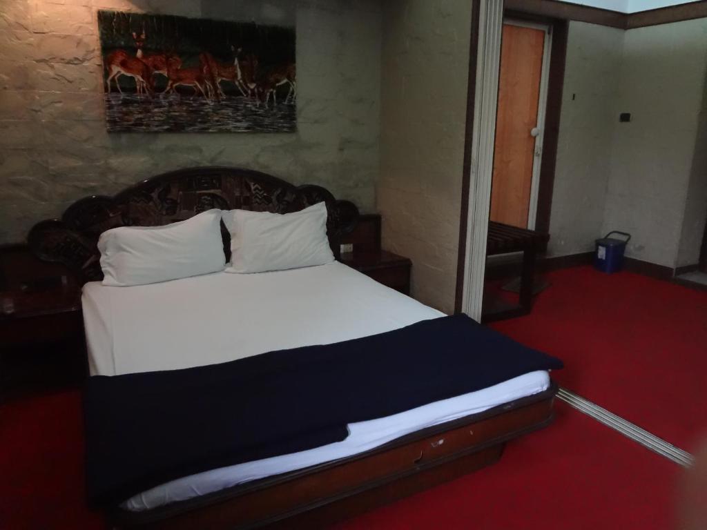 Postel nebo postele na pokoji v ubytování Hotel Happy Home