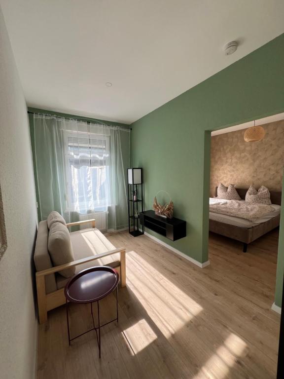 a living room with a couch and a bed at ElbUfer Glück in Schieritz