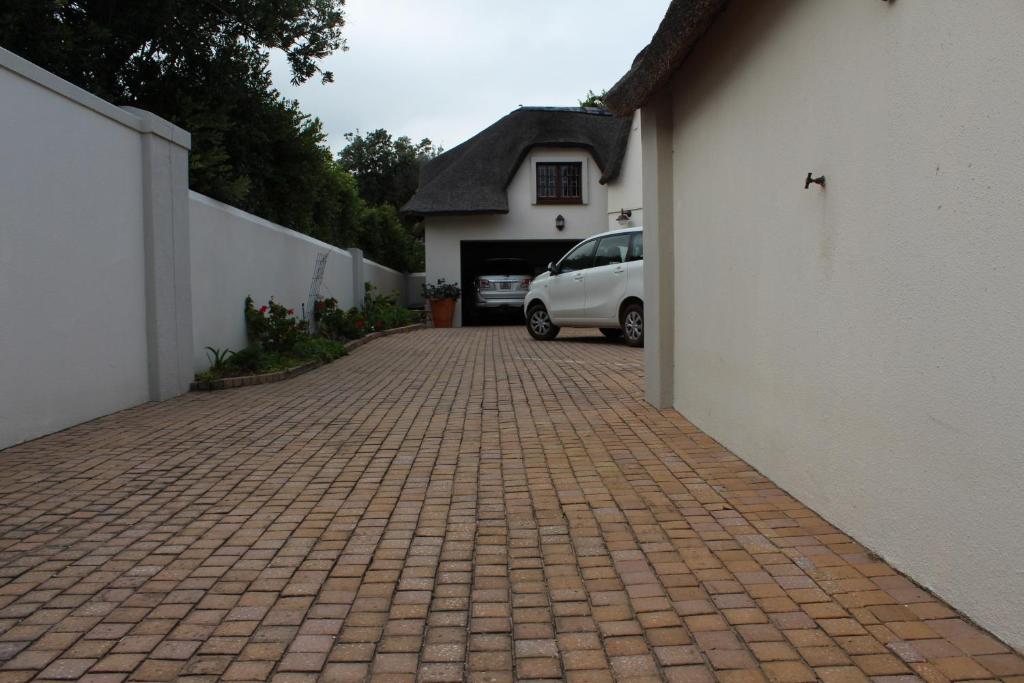 a white van parked in front of a house at Windfall Plett in Plettenberg Bay