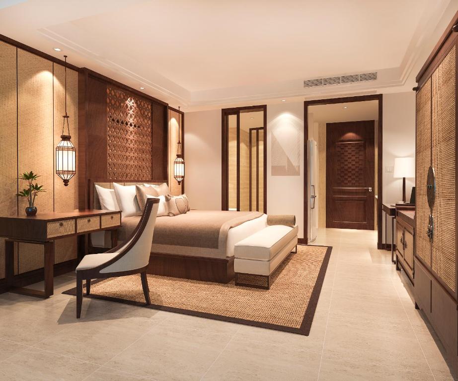 a hotel room with a bed and a desk and a desk at Hotel Luxury Villa - Near IGI Airport Mahipalpur New Delhi in New Delhi