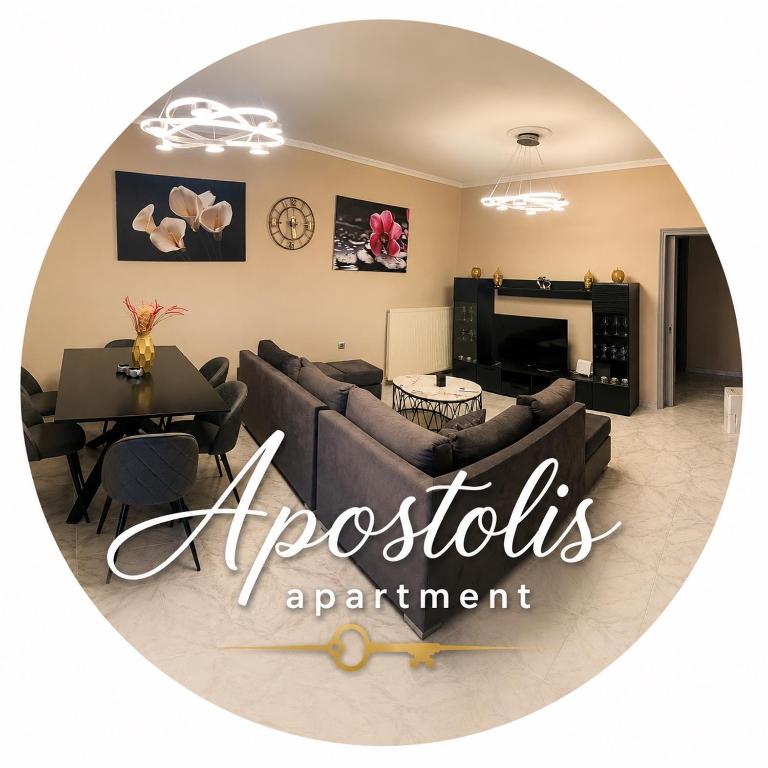 a living room with a couch and a table at Apostolis Apartment in Vonitsa