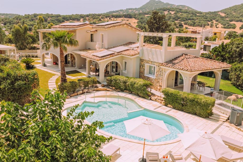 an aerial view of a villa with a swimming pool at Lentischi Hotel - Adults Only in Villasimius