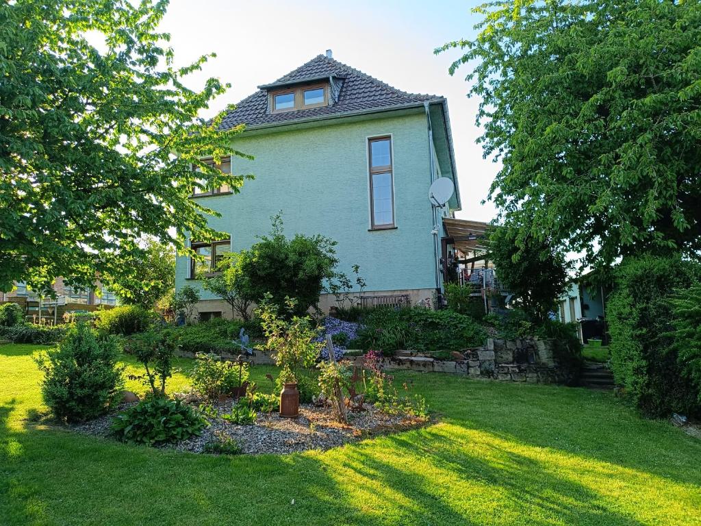 a house with a garden in the yard at FeWo Waschbär in Waldeck