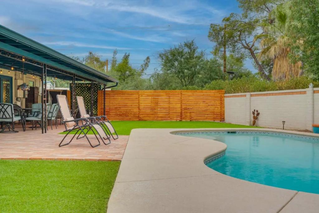 a backyard with a swimming pool and a patio at Private Tucson Oasis with Pool & Large Backyard in Tucson
