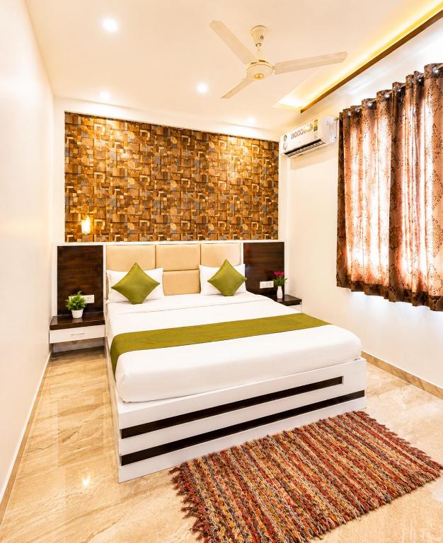 a bedroom with a large bed in a room at Hotel Star Grand - Premium Budget Hotel Near Taj mahal, in Agra