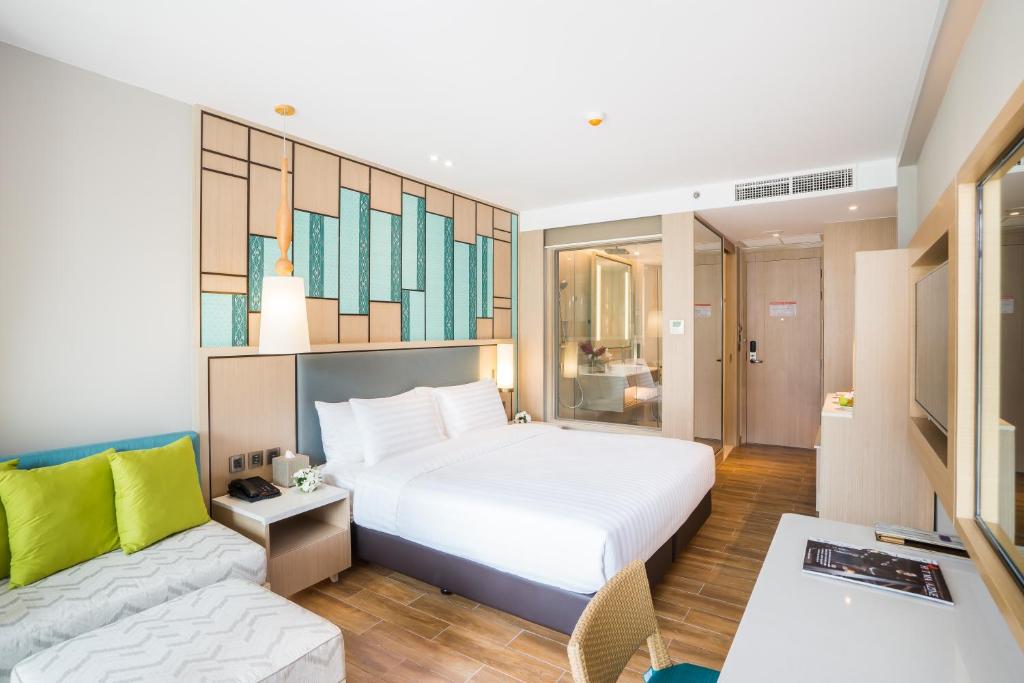 Postel nebo postele na pokoji v ubytování Avani+ Hua Hin Resort