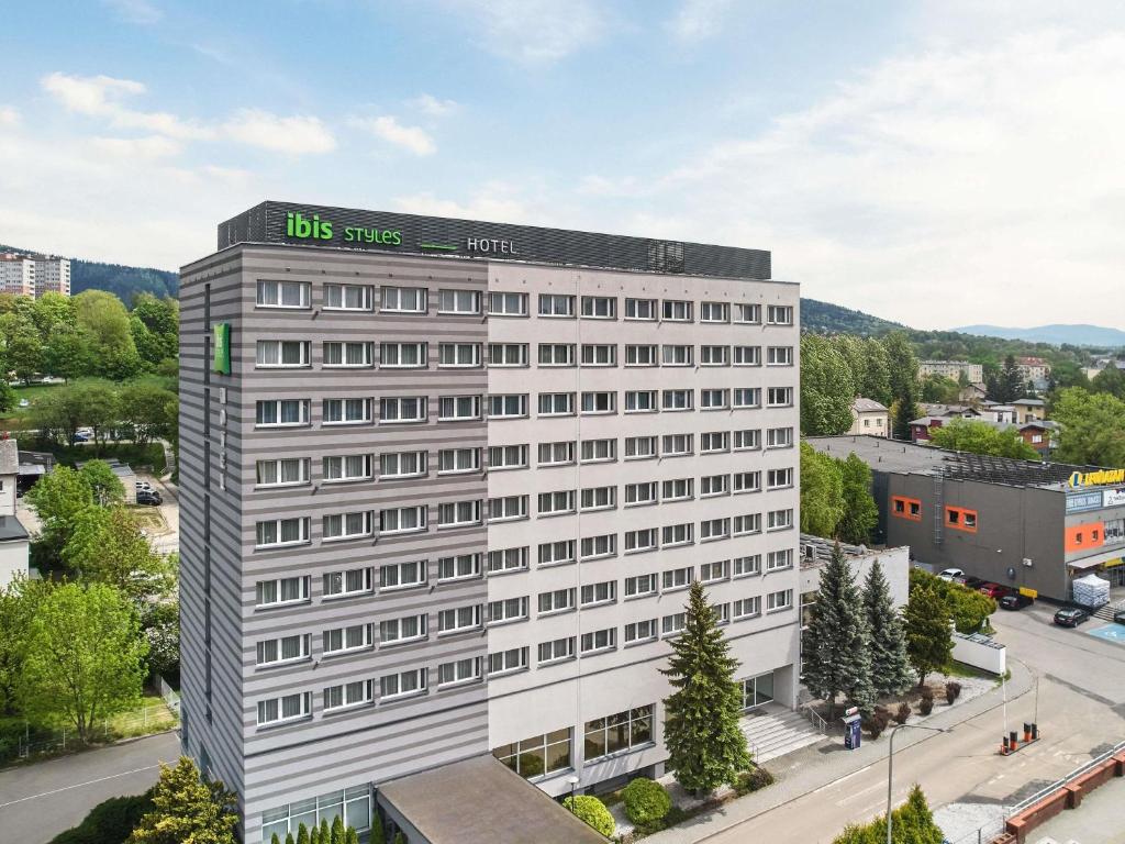 a white building with a sign on top of it at ibis Styles Bielsko Biala in Bielsko-Biała