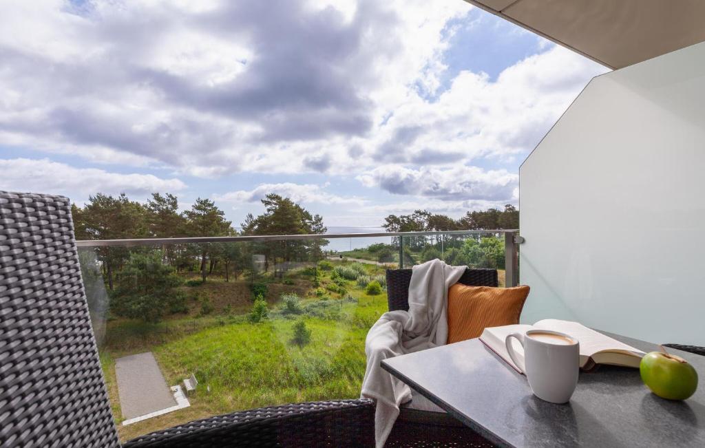 a balcony with a table and a view of a field at Princess in Binz