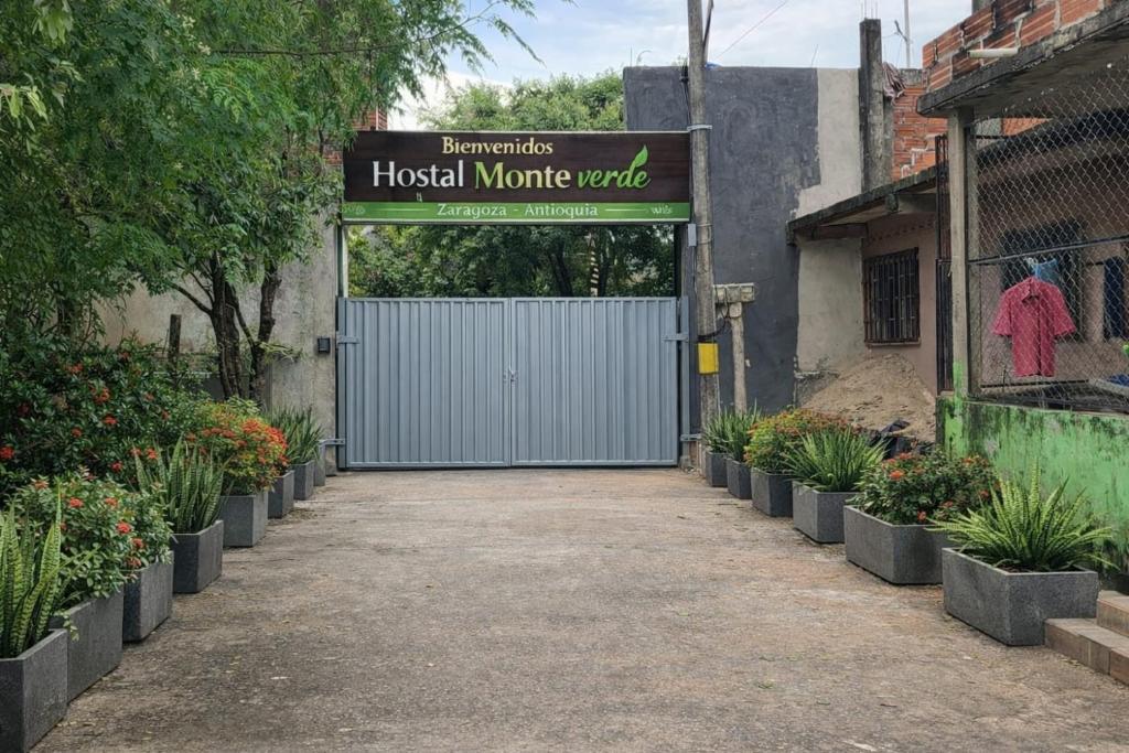 a blue garage door with a sign that reads hospital minute value at Hostal Monte Verde in Zaragoza
